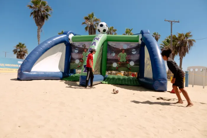 Inflatable soccer-kick game set up at a carnival event