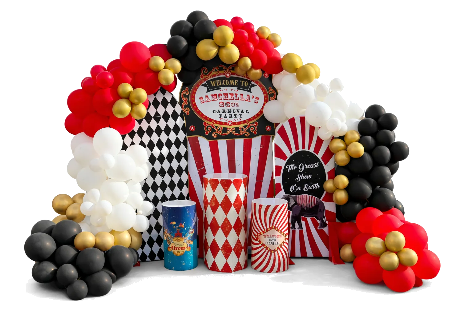 A styled cake table with themed linens, a centerpiece, and a balloon column beside it at an outdoor carnival event