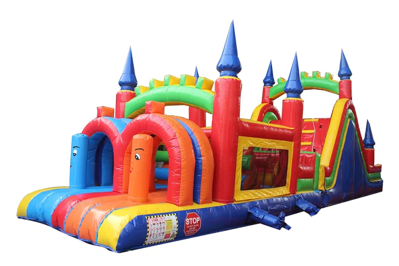 An obstacle-course inflatable anchored with sandbags on a paved lot near a base recreation building